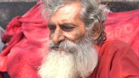Close up shot of an old man with grey beard outside Hanuman Mandir Stock Footage 164361871