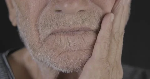 Close up shot of old man's touching his white beard. White senior man's lips  Stock Footage 142099660
