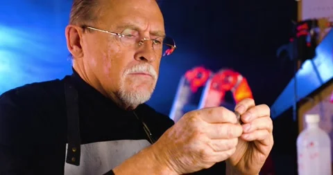  Close up shot of old mechanic master working in his workshop.  Stock Footage 130920049