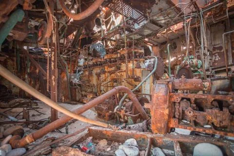Close-up shot of an old rusty ship engine room. Stock Photos