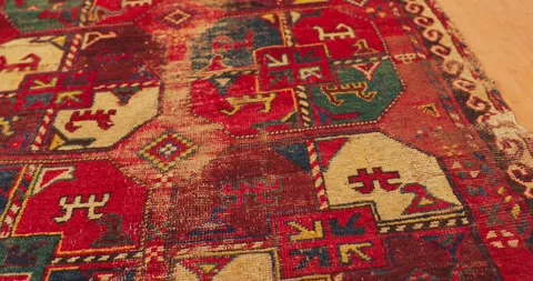 Close up shot of an old shabby handmade carpet made by Samarkand masters using Stock Footage 264085214