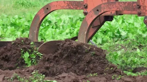 Close up shot of Old Soviet Tractor And Plowing Stock Footage 239679015