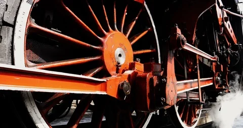 Close shot old steam engine train locomotive wheels start spinning, white Stock Footage 123577274