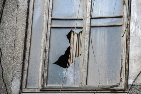 Close up shot for old window with broken glass Stock Photos