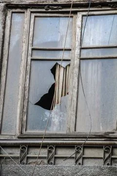 Close up shot for old window with broken glass Stock Photos