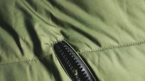 Close up shot of olive green jacket pocket zipper. Stock-Footage 346189571