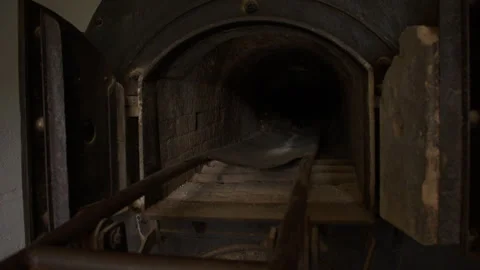 Close up shot of an open chamber in old crematorium furnace with heavy rust Stock Footage 299051613