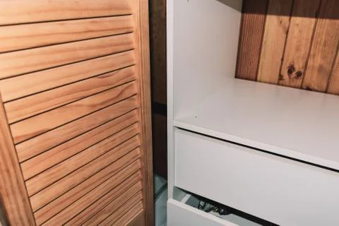 A close-up shot of an open empty modern wardrobe Stock Photos
