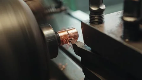 Close-up shot operation of lathe machine cutting the brass shaft parts and the Stock Footage 281581169