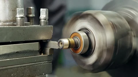 Close-up shot operation of lathe machine cutting metal part edge and the cutting Stock Footage 285643139