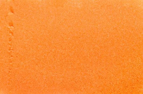 Close-up shot of orange sponge texture Stock Photos