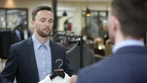 A close up shot over the shoulder of a dark haired business man taking a look at Video stock 135764882