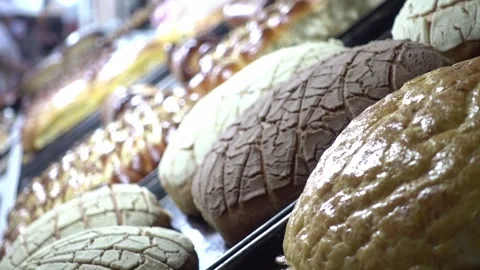 Close up shot over some different delicious breads in a counter. 動画素材 243968479