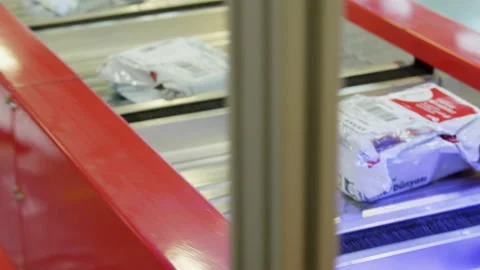 Close shot on packages moving on Sorting Machine Stock Footage 195237053