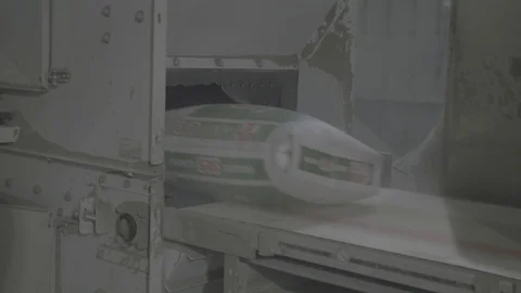 Close up shot of a packed cements coming out of the machine Stock Footage 106378701