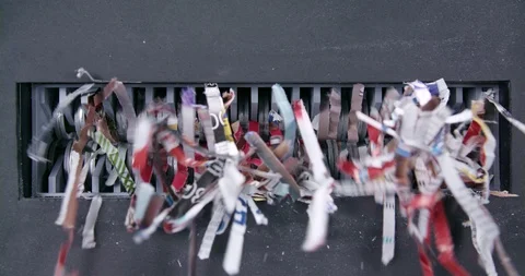 Close shot of paper being shredded through mechanical jaws Video stock 123729402
