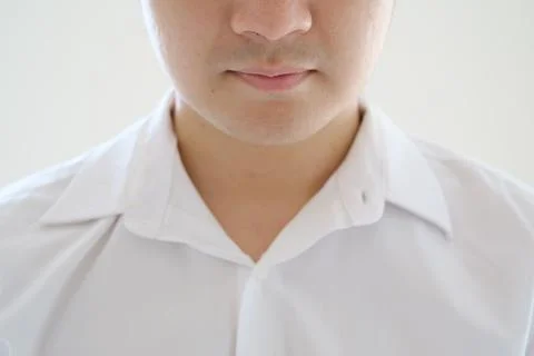 Close-up shot of a partial man's face from his nose to his chest wearing a .. Stock Photos
