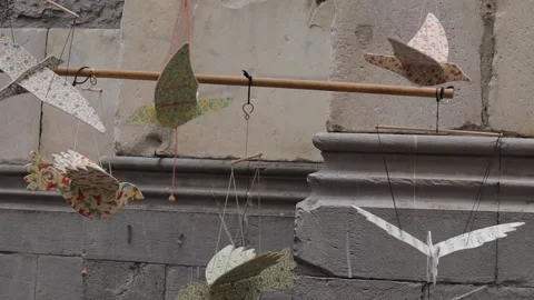 Close up shot of patterned models of birds on display in market, moving Stock Footage 271272685