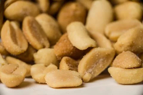 Close up shot of peanuts in a pile. Stock Photos