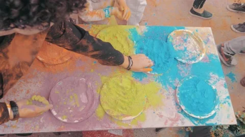 Close-up shot of people's hands taking colorful holi powder. Stock Footage 167929936