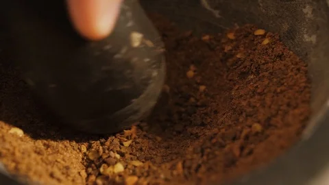 A close-Up Shot of pepper Grinding with a Mortar and Pestle. Stock Footage 121891439