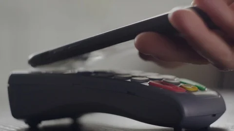 Close-up shot of person using NFC smartphone technology to pay, typing password  Stock Footage 114668447