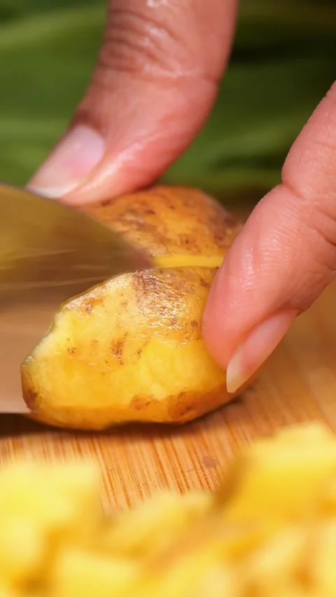 Close-up shot of a person using a sharp knife to peel a fresh ginger root o.. Stock Footage 333033228