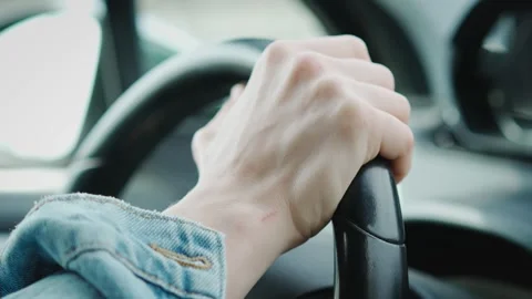 Close-up shot of a person's hand on the steering wheel Stock Footage 267539270