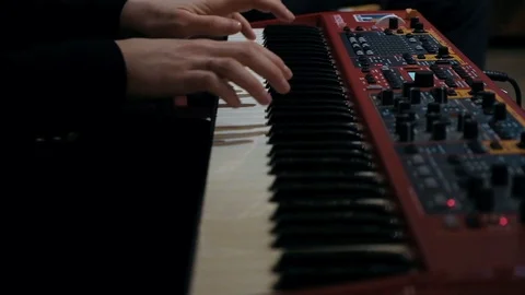 Close up shot of pianist hands playing live on synth Stock Footage 126934124