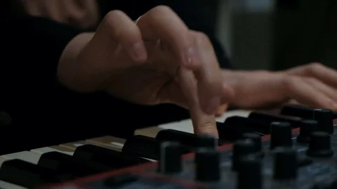 Close up shot of pianist playing on synth live music on cajon with drum brushes Stock Footage 126934939