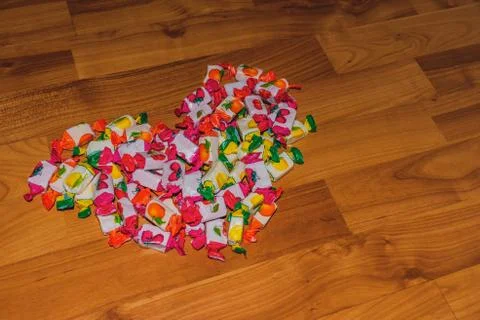 A close-up shot of a pile of assorted chewing sweets with fruit flavors in th Stock Photos