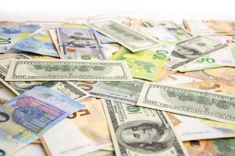 A close-up shot of a pile of various US dollar and euro banknotes Stock Photos