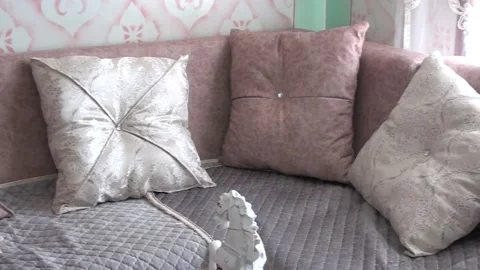 Close-up shot of pillows on a modern sofa Stock Footage 235394420