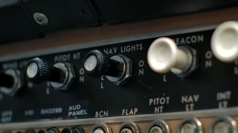Close Up Shot of Pilot Hand Actuating Light Switch in Airplane Cockpit Stock Footage 305542788