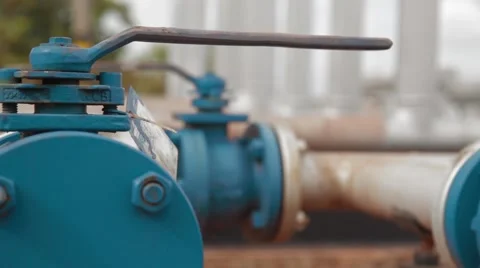 Close Up Shot of Pipes and Valves at an oil and gas Well Stock Footage 45236773