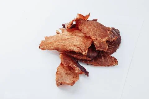 A close-up shot of a pitmaster cleanly slicing through the tender cut Stock Photos