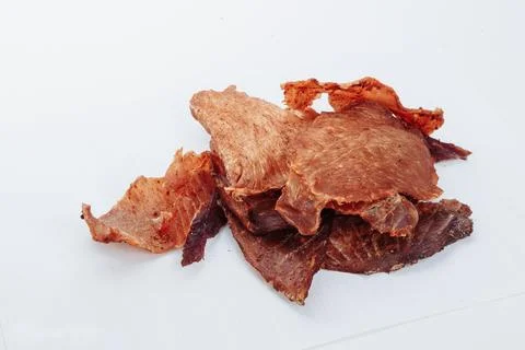 A close-up shot of a pitmaster cleanly slicing through the tender cut Stock Photos