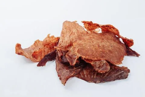 A close-up shot of a pitmaster cleanly slicing through the tender cut Stock Photos