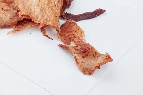 A close-up shot of a pitmaster cleanly slicing through the tender cut Stock Photos