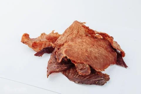 A close-up shot of a pitmaster cleanly slicing through the tender cut Stock Photos