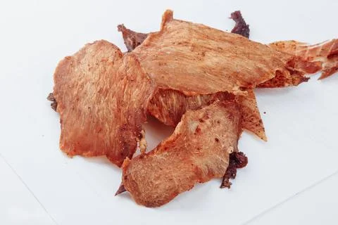 A close-up shot of a pitmaster cleanly slicing through the tender cut Stock Photos