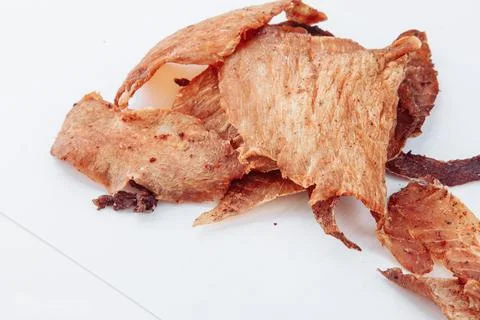 A close-up shot of a pitmaster cleanly slicing through the tender cut Stock Photos