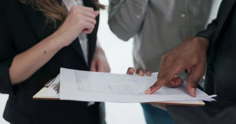 Close up shot on plan of the house potential customers discussing the pan of the Stock Footage 277683841