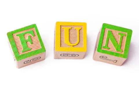 Close up shot of playing cubes forming a word fun Foto stock