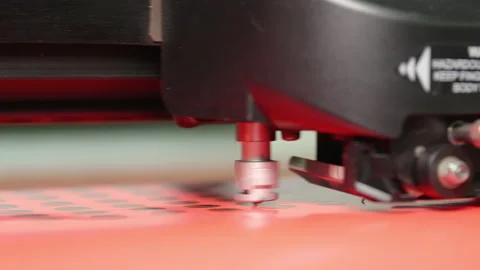A close-up shot of a plotter cutting out round stickers. Stock Footage 163086442