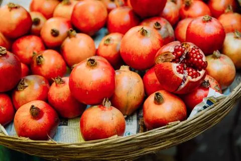 Close up shot of pomegranates in a basket Stock Photos