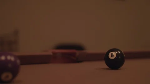 Close up shot of a pool table, hitting the 8 ball into the socket in 4k. Stock Footage 88685572