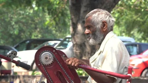 Close up shot of a poor disabled man outside Hanuman Mandir Stock Footage 164361869