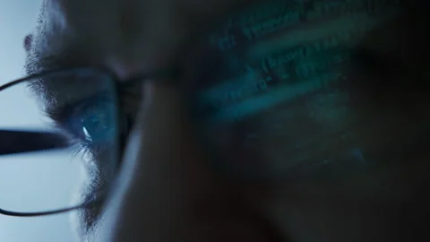 Close up shot of portrait of software engineer coding on computer. Line of hack Stock Footage 225728711