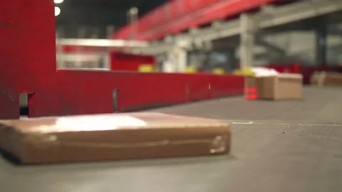 Close Shot of Postal Packages moving on belt at Postal Transfer Facility Stock Footage 195236621